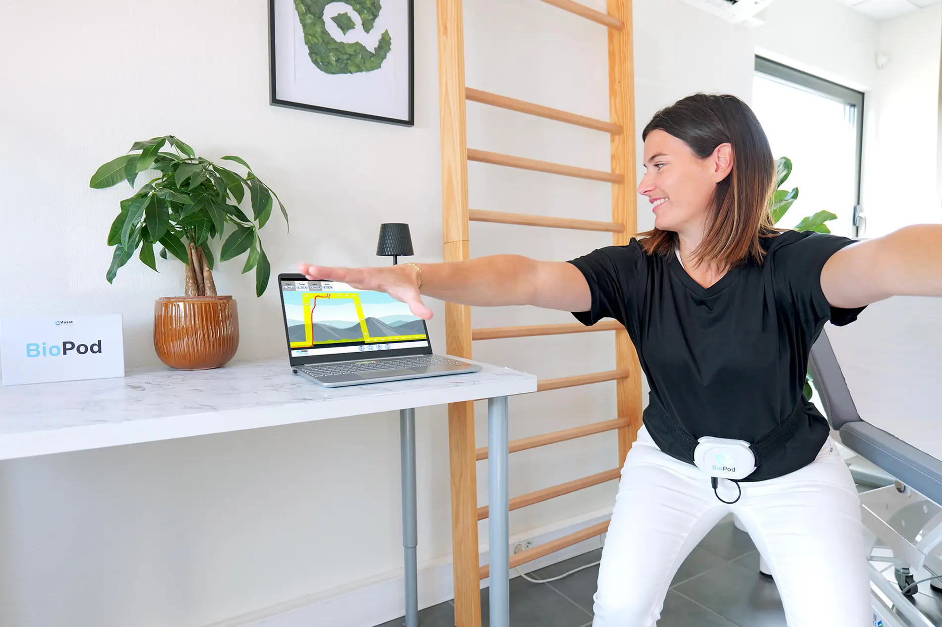 Patient in squat position with BioPod for biofeedback exercise targeting incontinence, postpartum, and pelvic pain, with real-time monitoring on screen